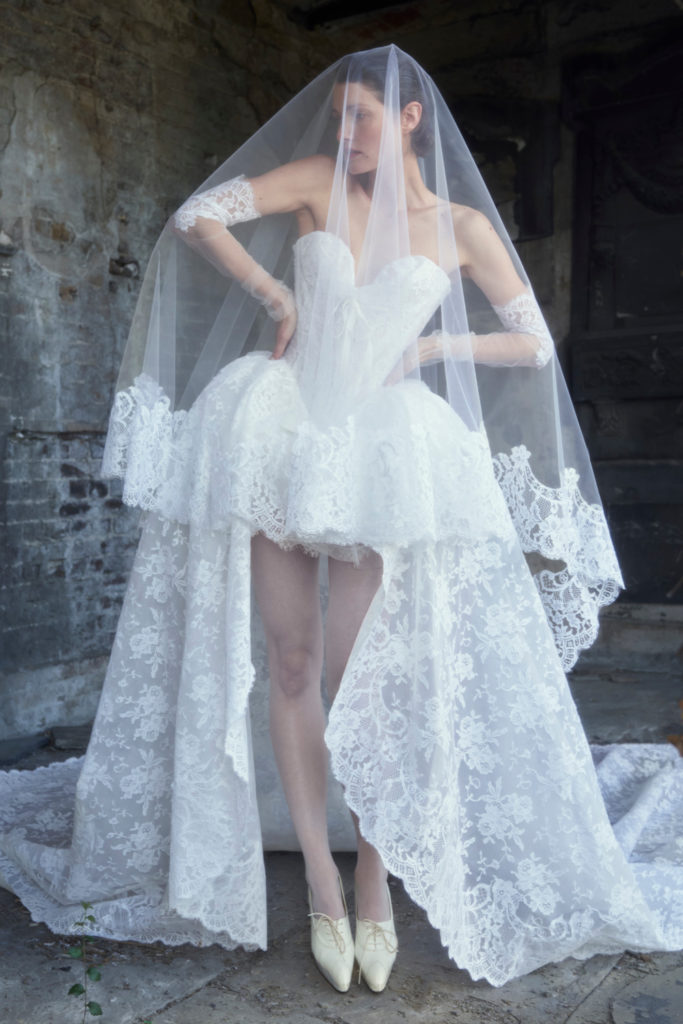 Woman wearing short wedding dress and veil