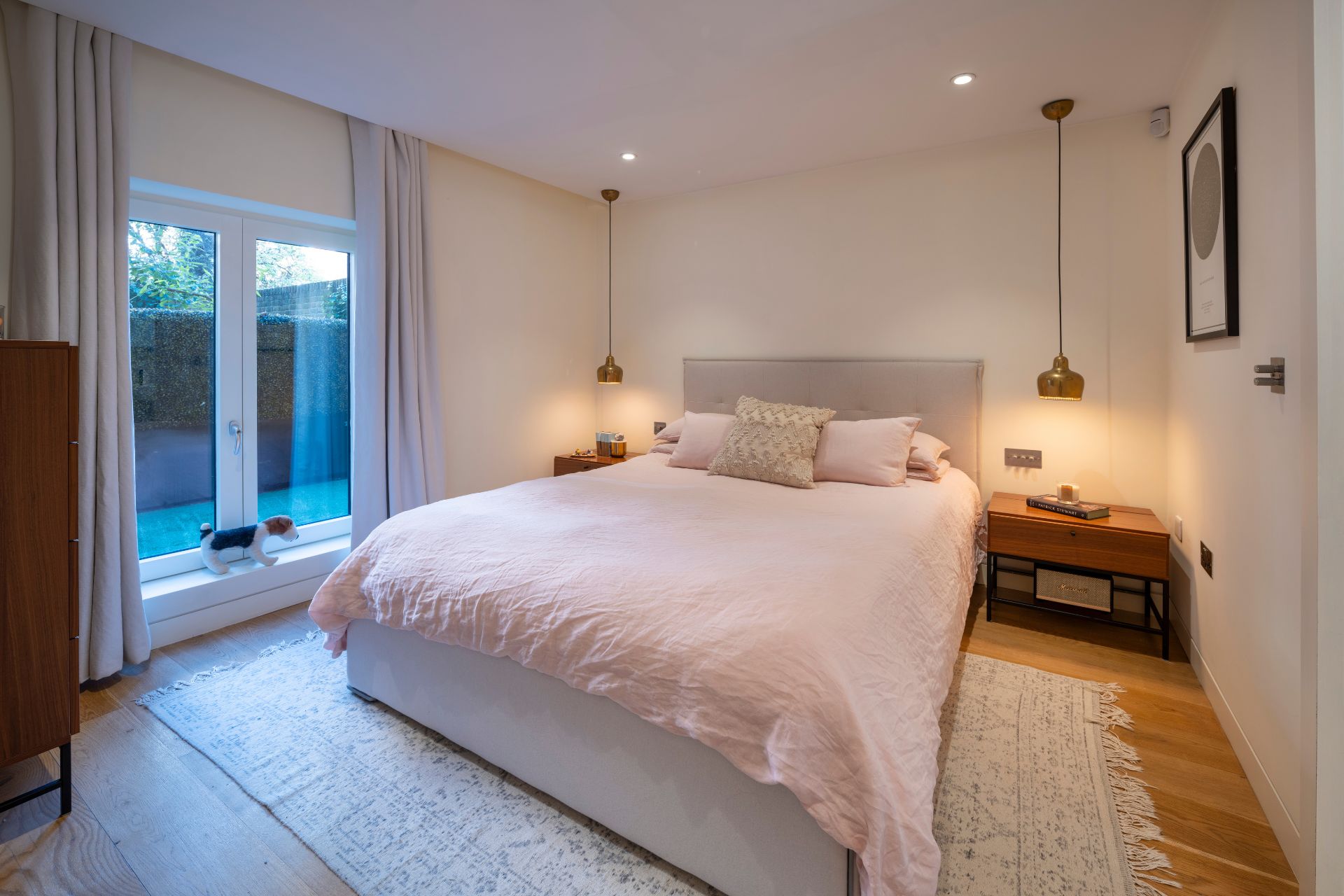 Bedroom with French doors amd cream walls