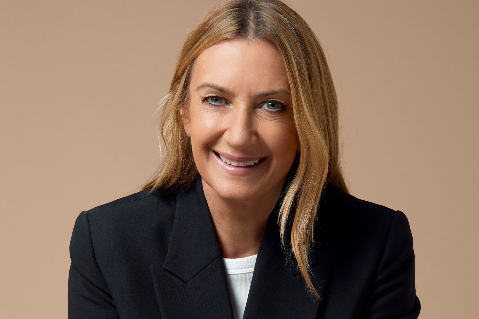 Anya Hindmarch wearing a black blazer and white shirt