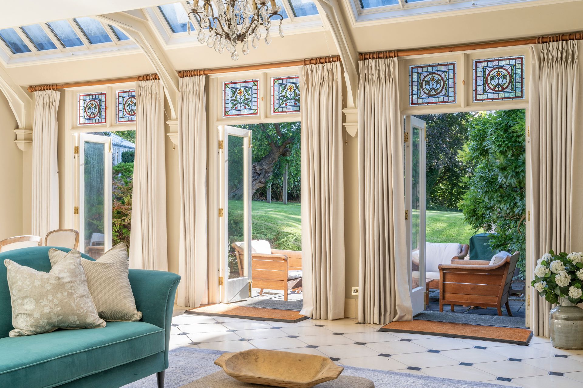 Orangery with floor tiles and chandelier