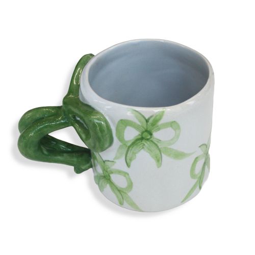 White mug with green bows and bow handle