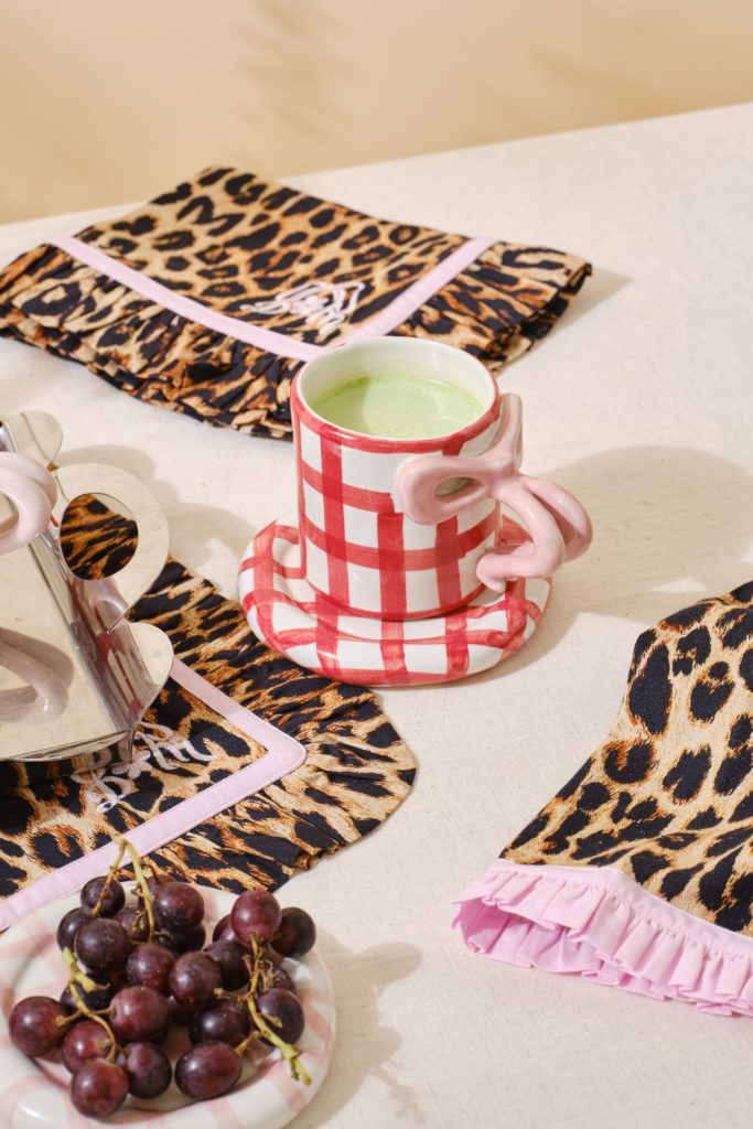 Leopard print placements and pink and red gingham mugs