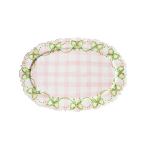 Pink gingham platter with green bow design at the edges