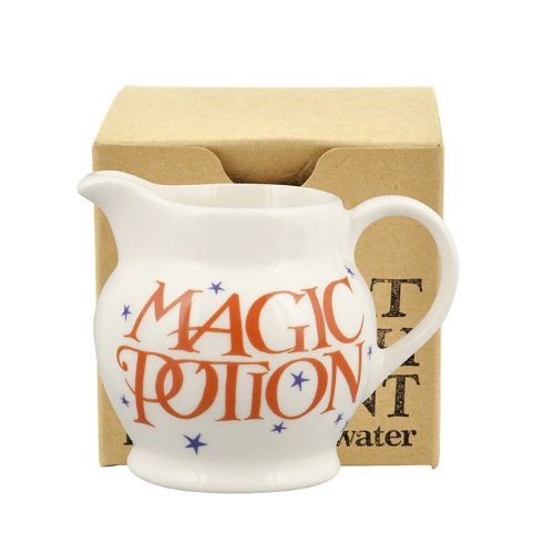 White jug with orange 'magic potion' script