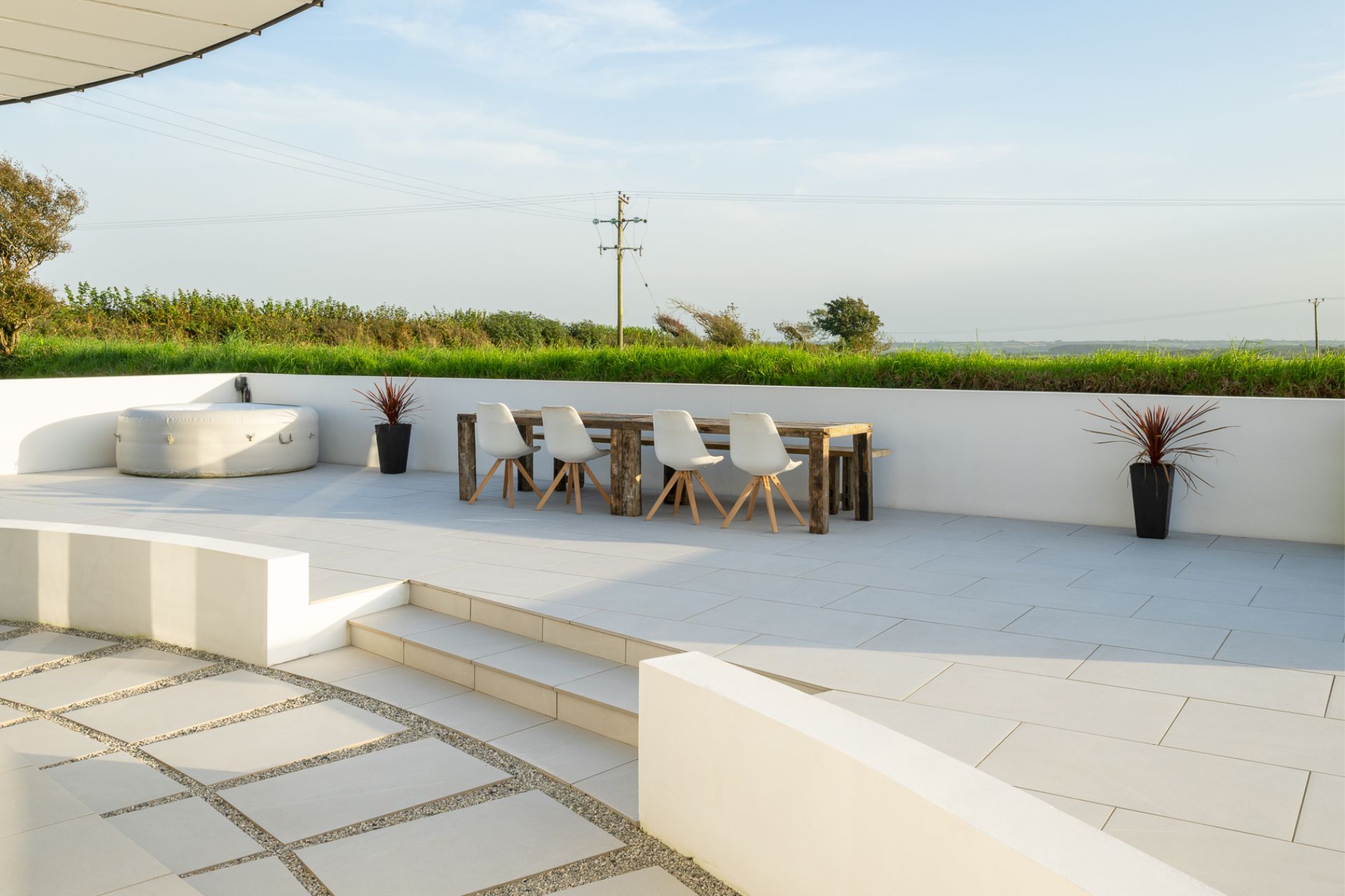 Porcelain-tiled outdoor terrace with countryside views