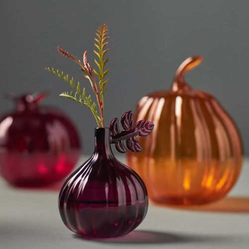 Orange bud vases in the shape of pumpkins