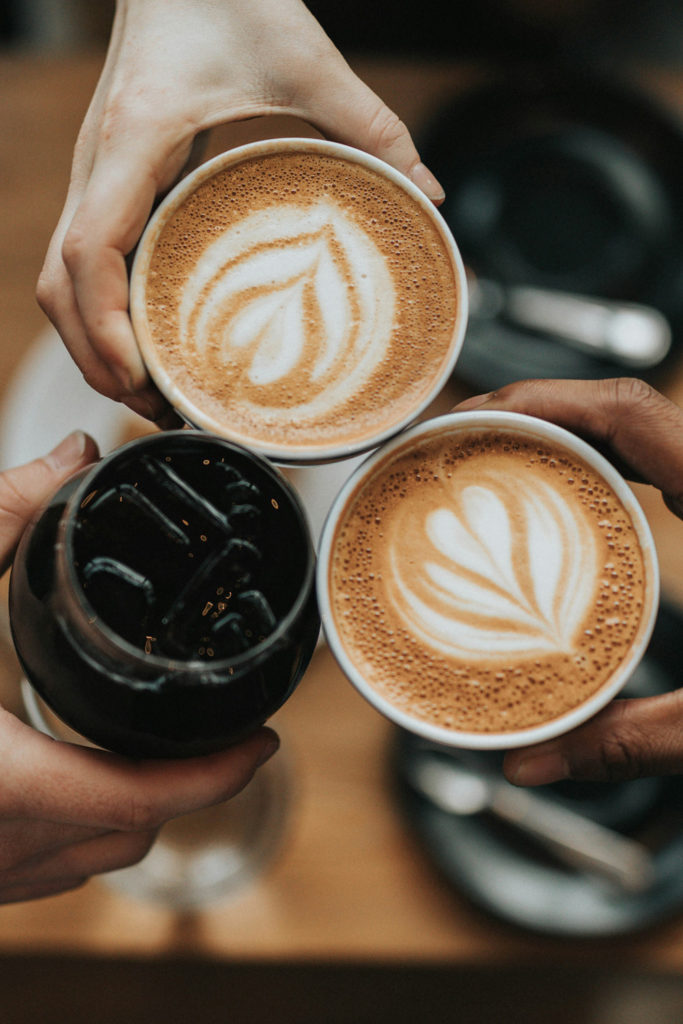 People cheers with coffee