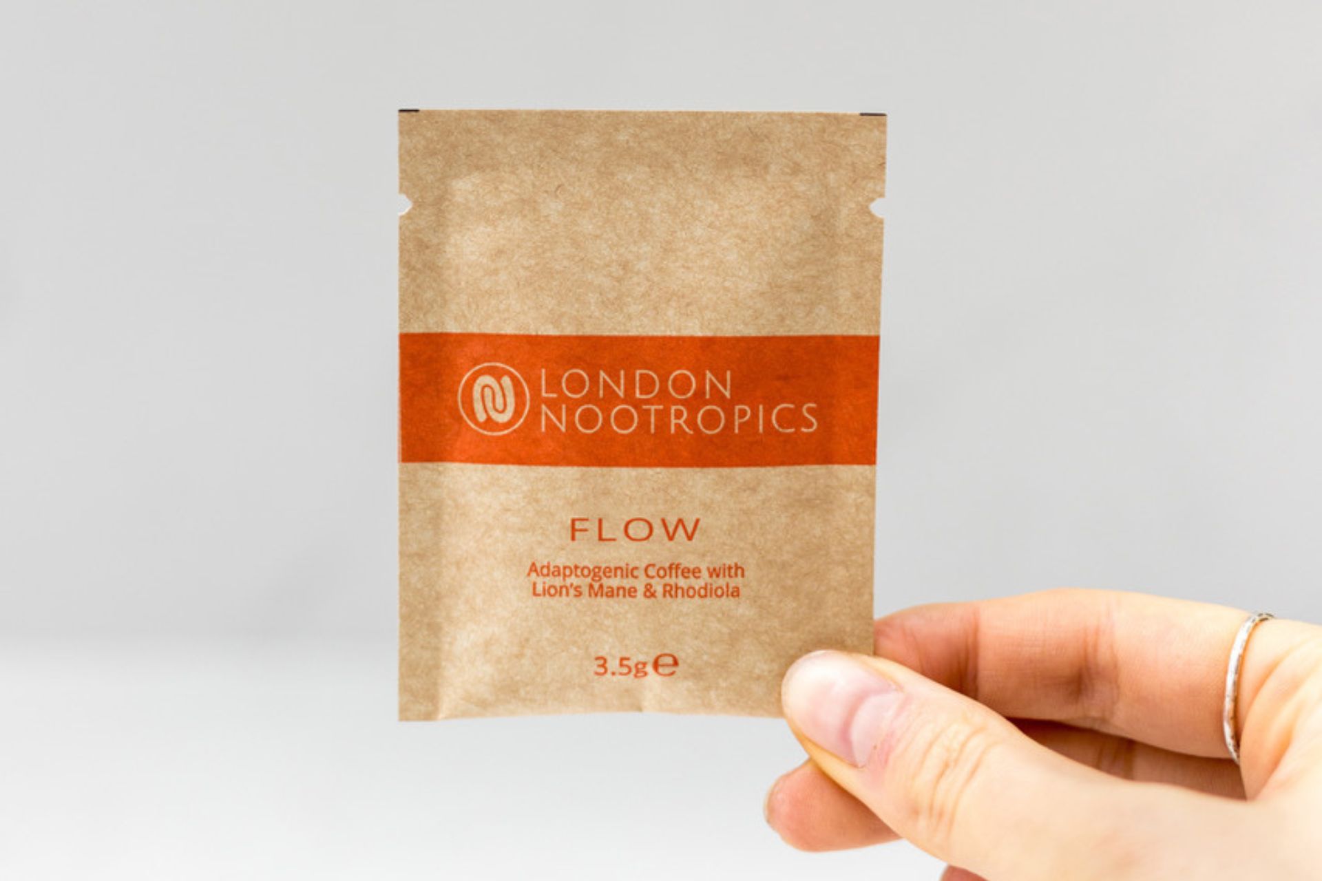 Sachet of coffee with orange Nootropics branding