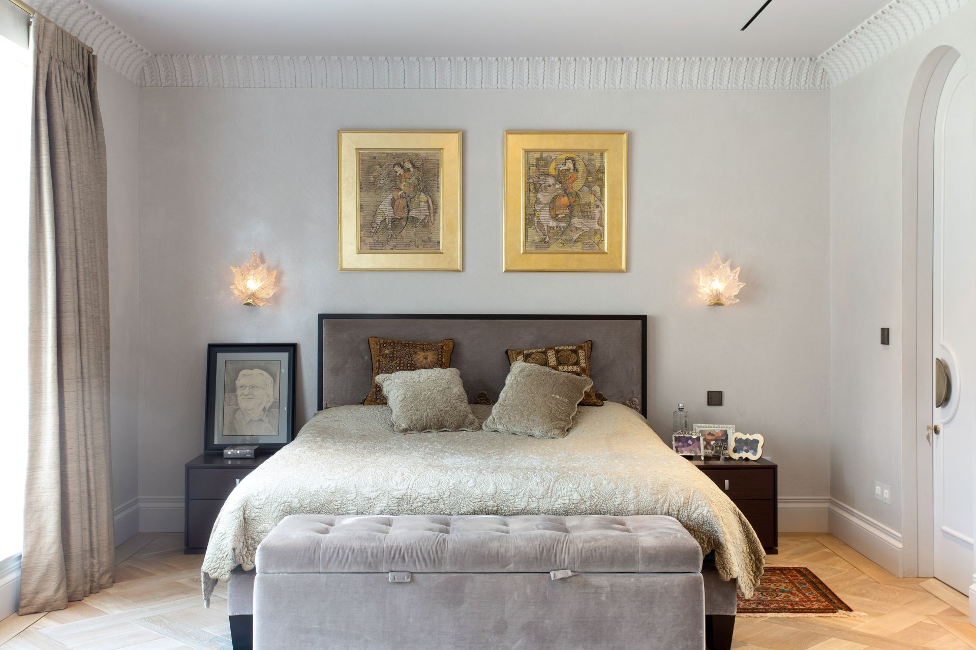 Bedroom with a grey headboard and white bedding