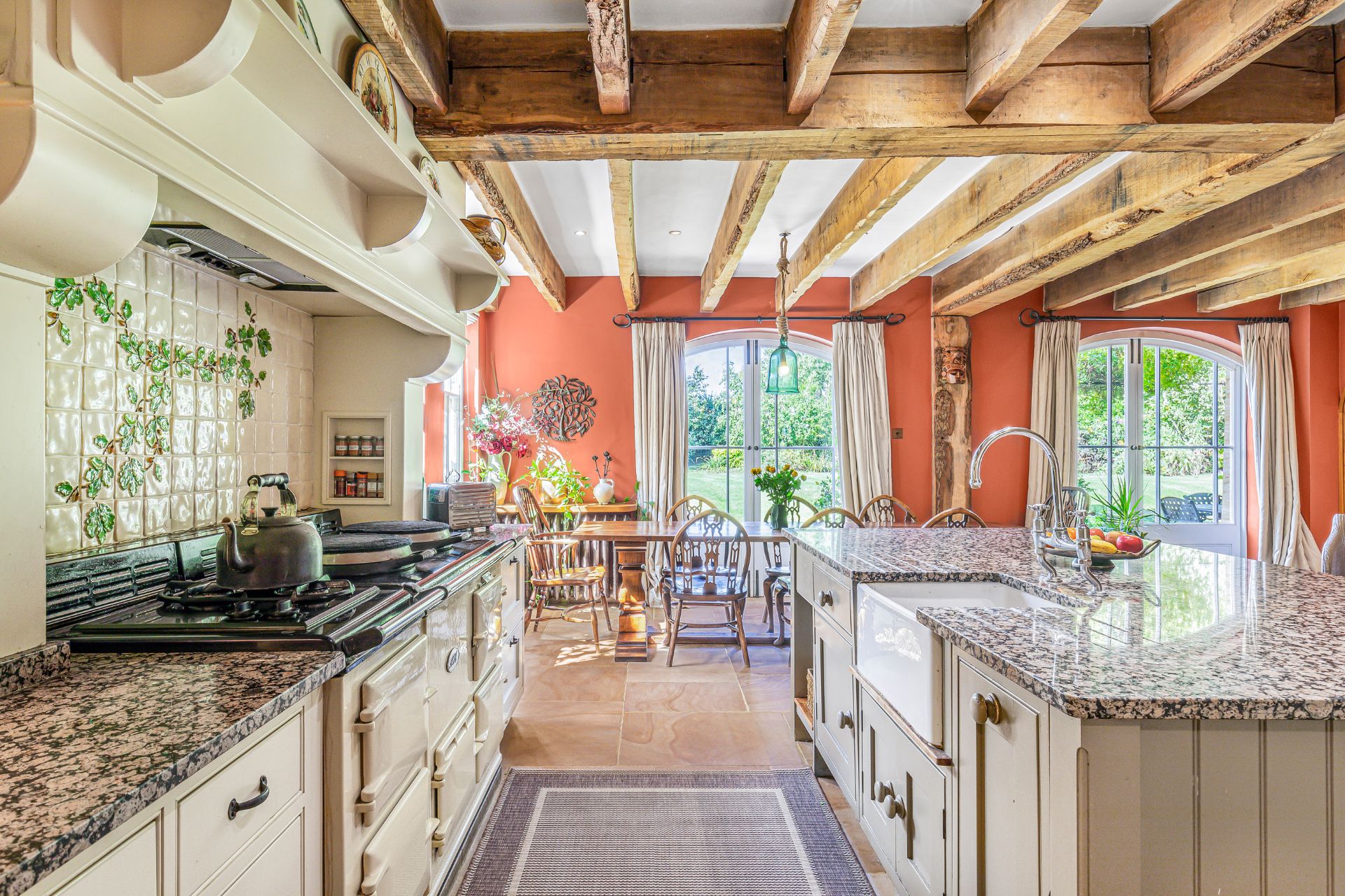 Kitchen with white cabinets and grey granite countertops