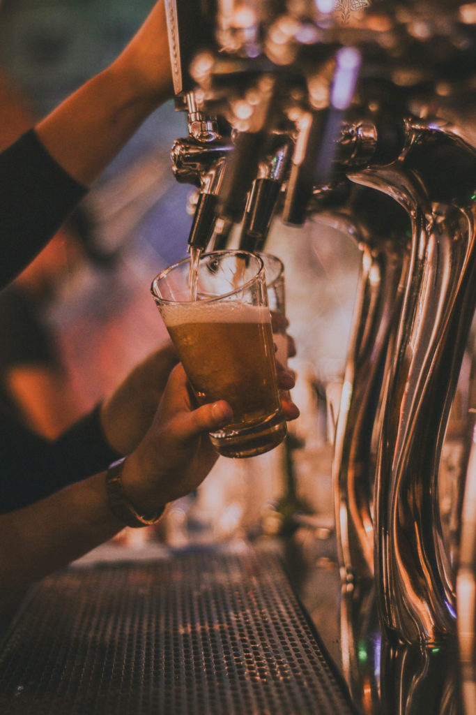 A hand pulling a pint