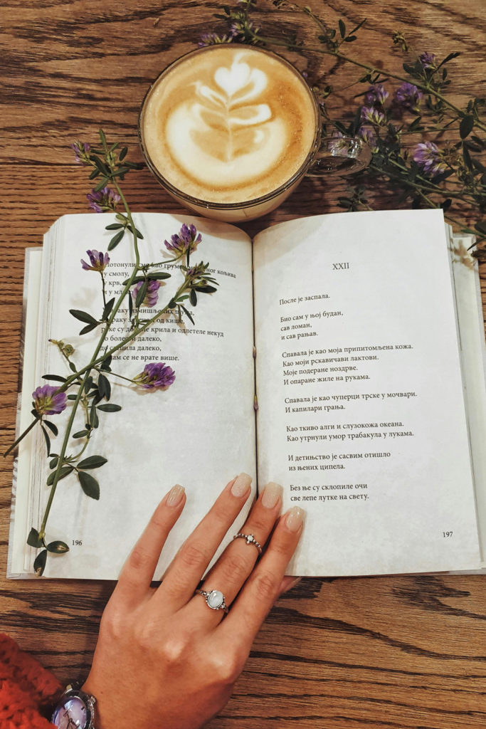 A book of poetry and a coffee