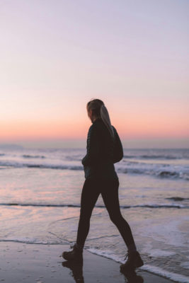 Woman walking on the beach