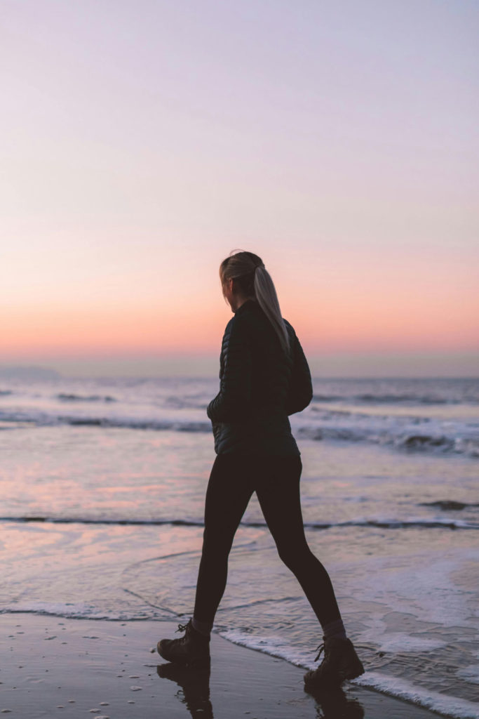 Woman walking on the beach