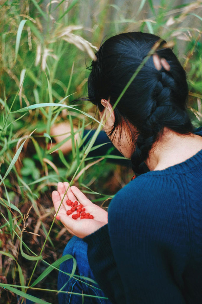 Woman foraging berries