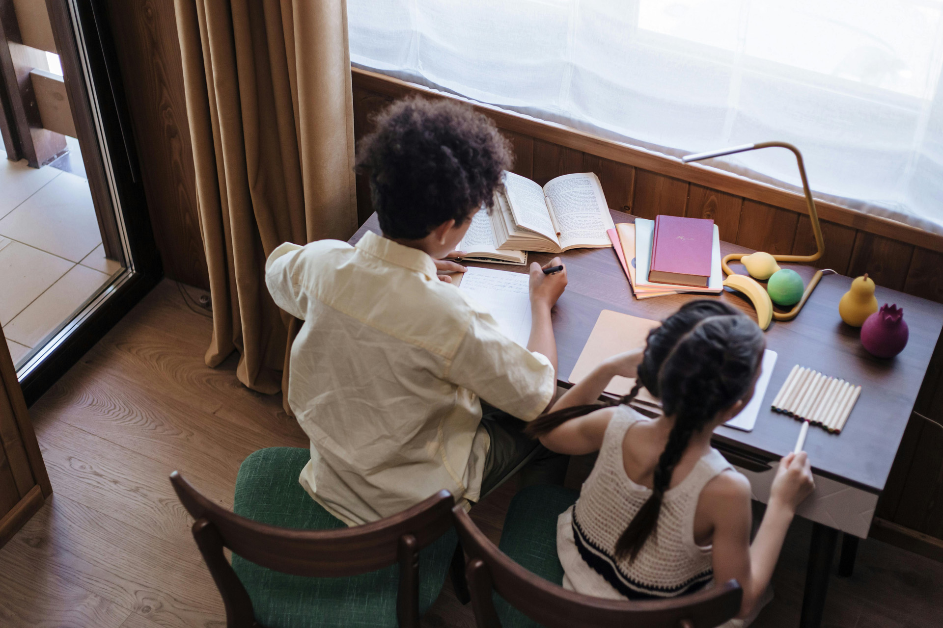 Two children writing poetry