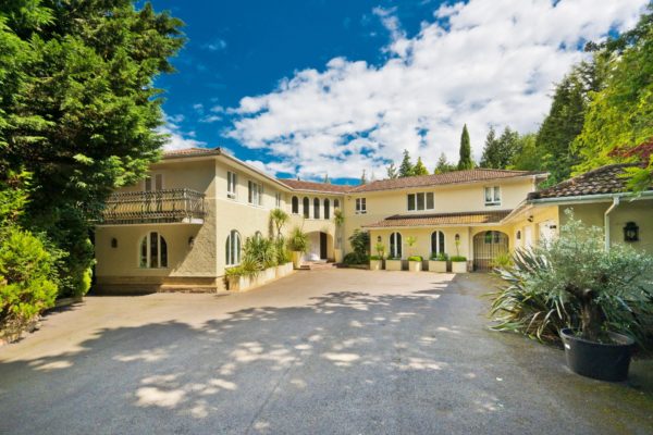 Tuscan-style villa with a butter yellow exterior