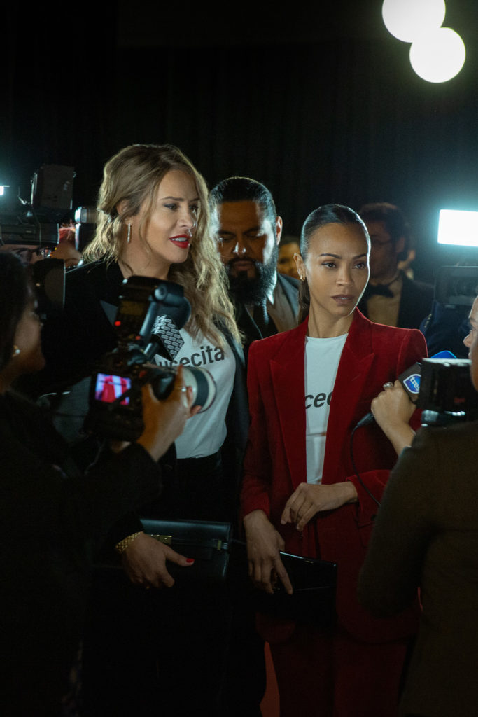 Karla Sofía Gascón as Emilia Pérez and Zoe Saldaña as Rita Moro Castro in Emilia Pérez