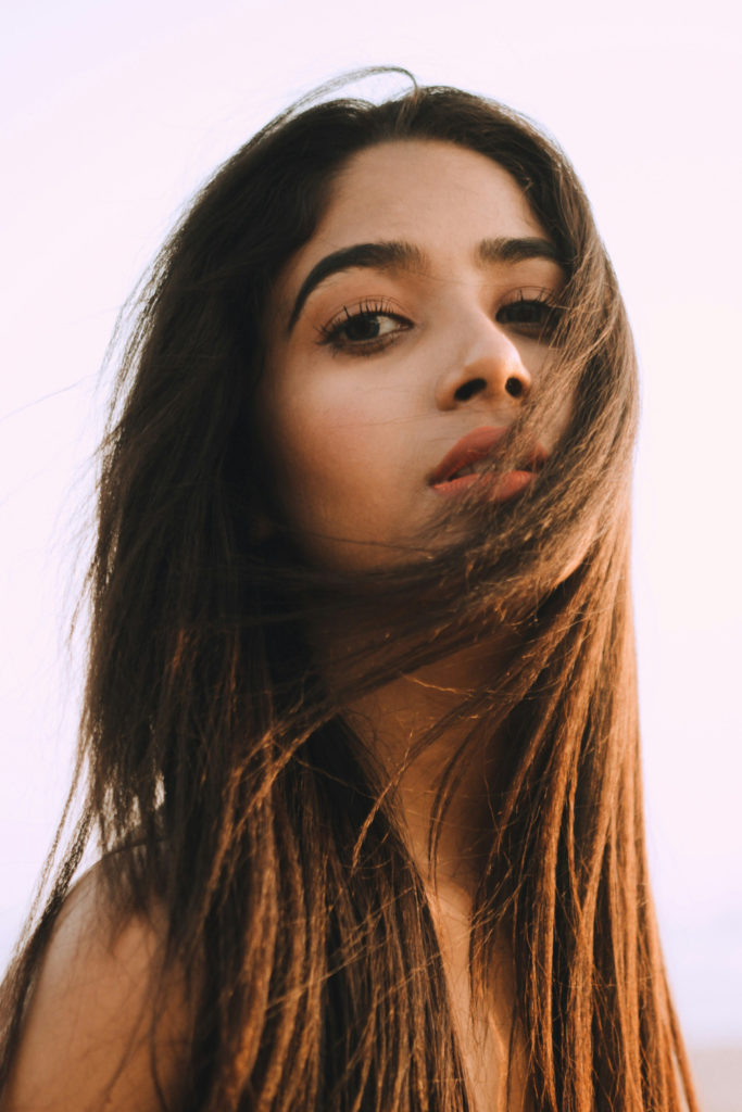 Woman with long hair and clear skin | winter solstice