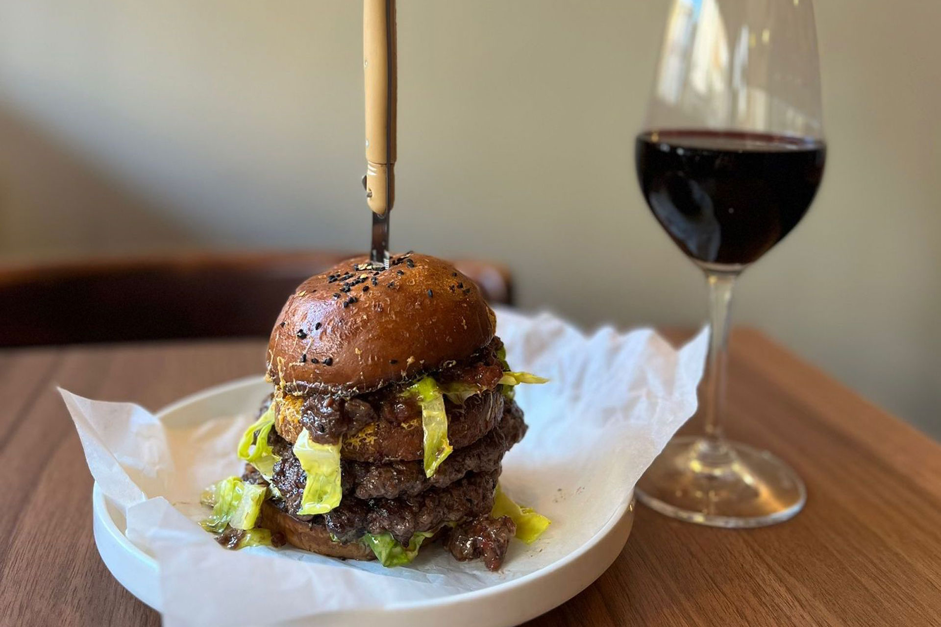 Burger and glass of red wine