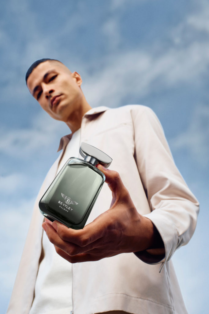 Man holding perfume bottle