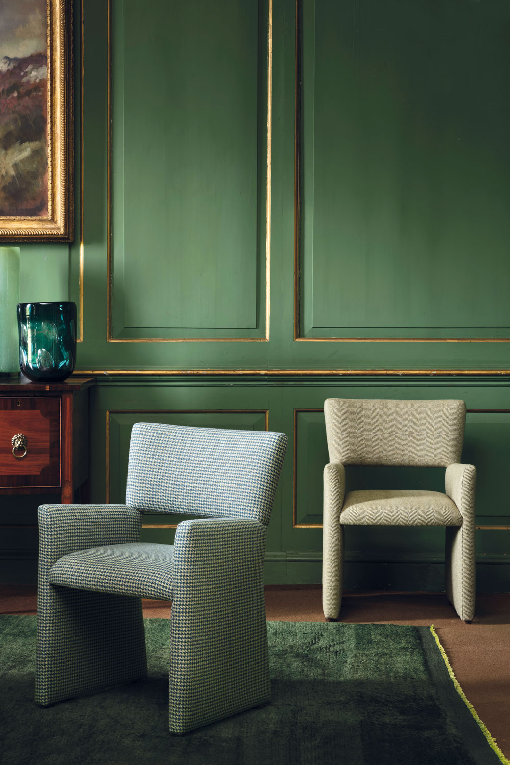 Chairs against a green background