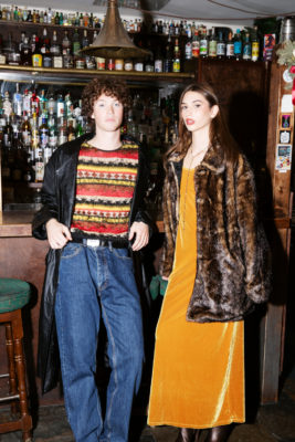 Man and woman in vintage clothing at pub