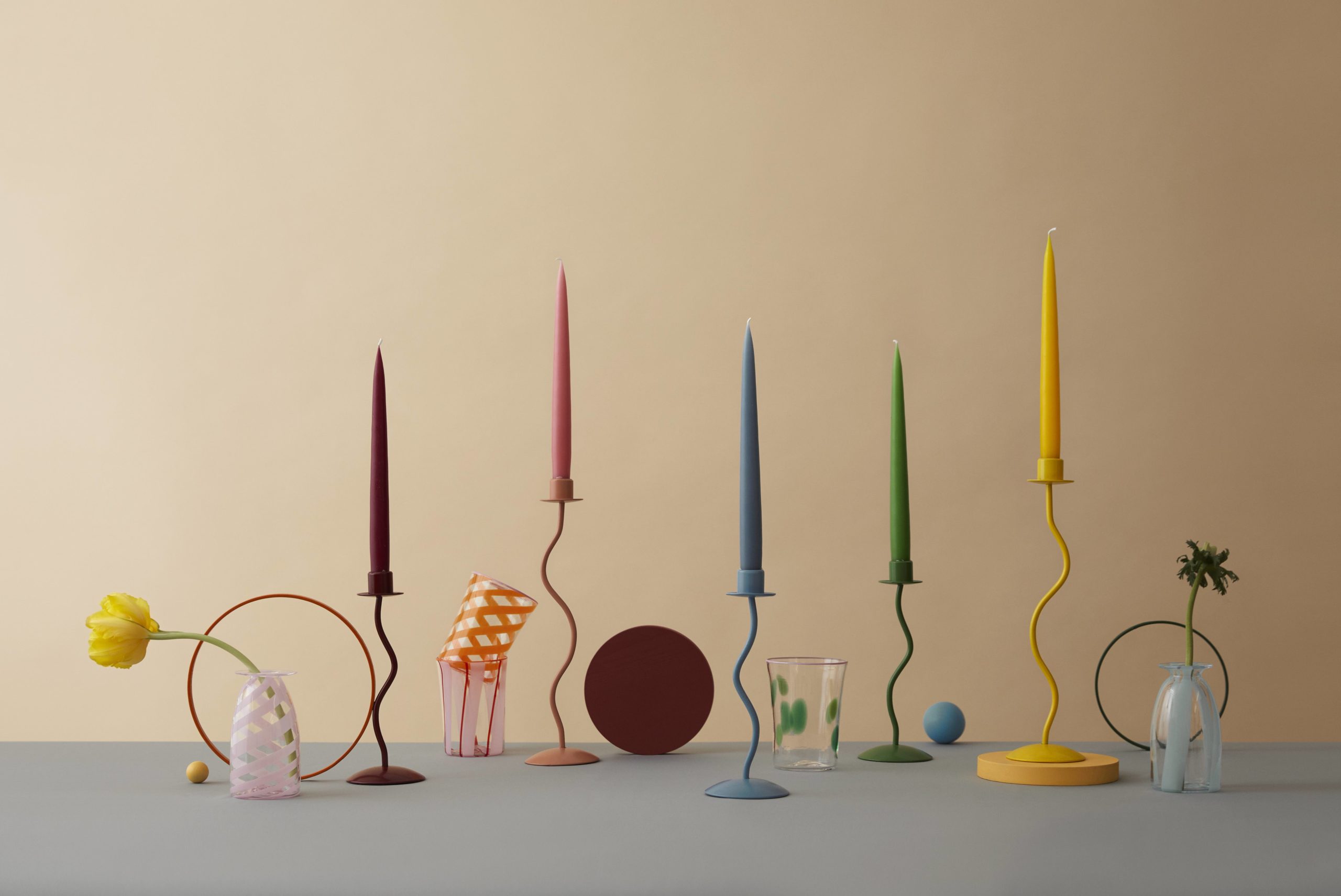 Selection of wavy candlesticks and Murano glass, all in bright colours