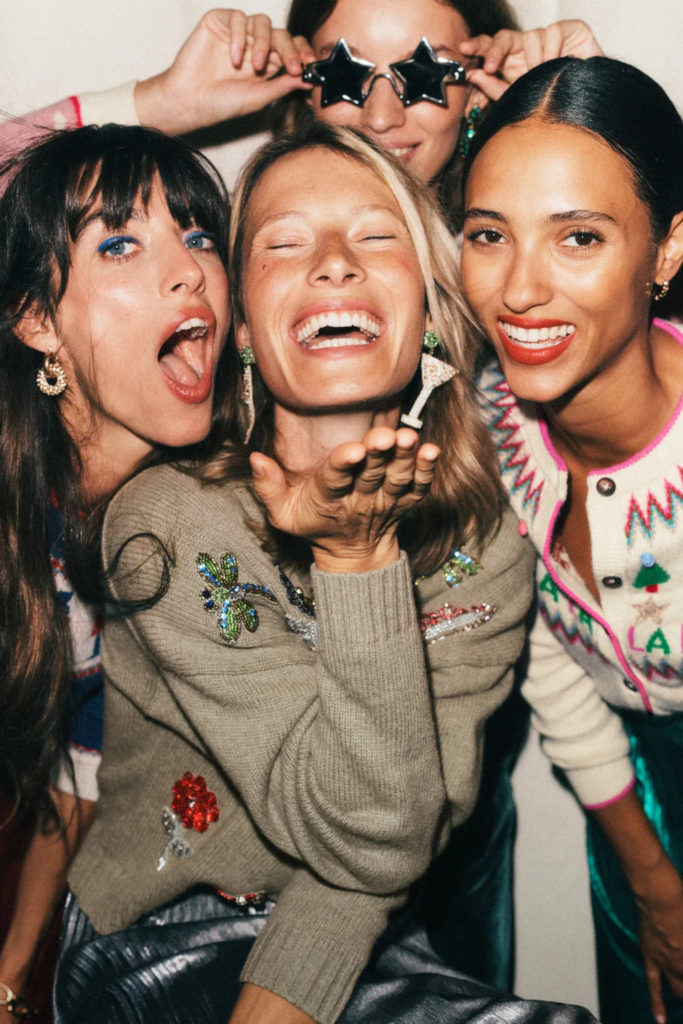 Women wearing 2024 Christmas jumpers