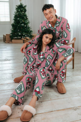 Man and woman in Christmas pyjamas
