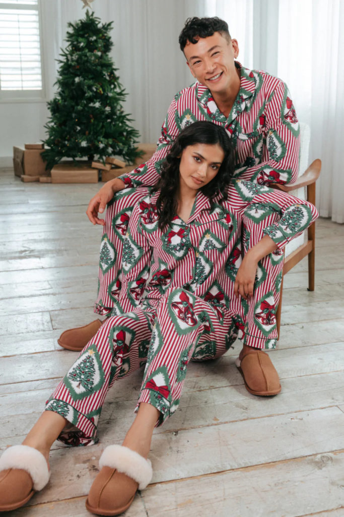 Man and woman in Christmas pyjamas