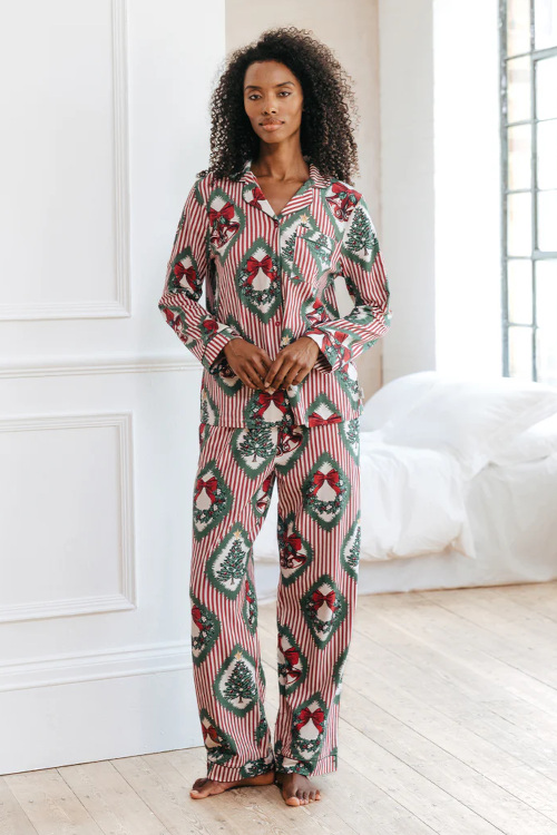 Woman in Christmas-themed pyjamas