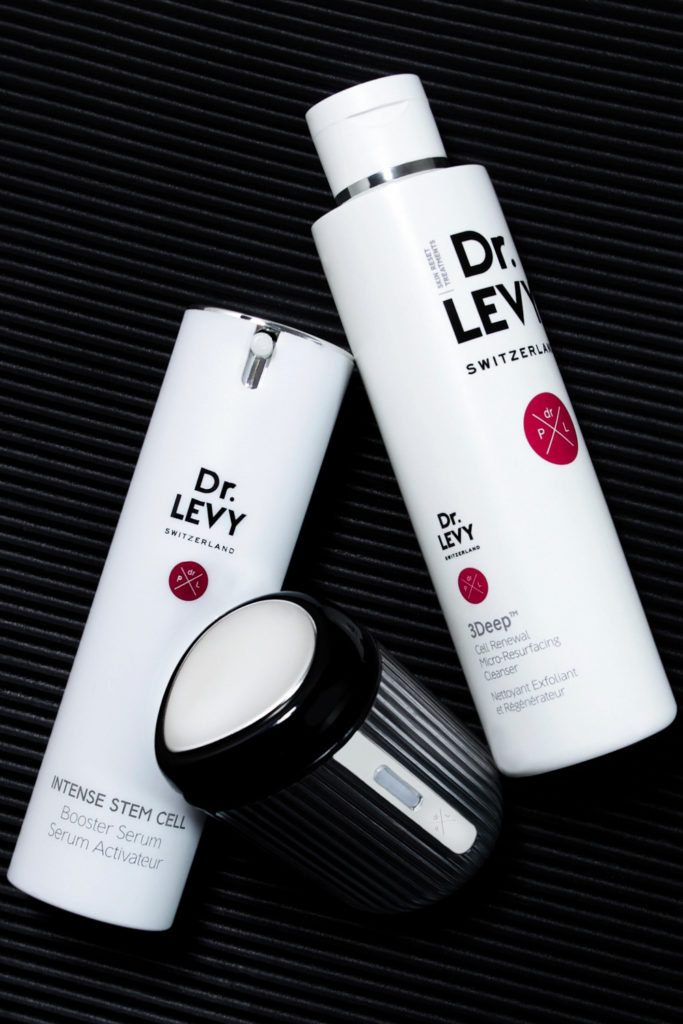 Skincare products on black background