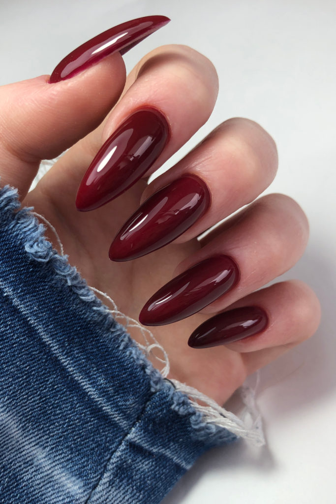 Hand with cabernet nails