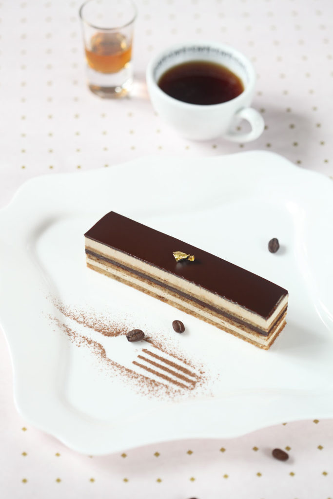 Opera cake with a cup of tea