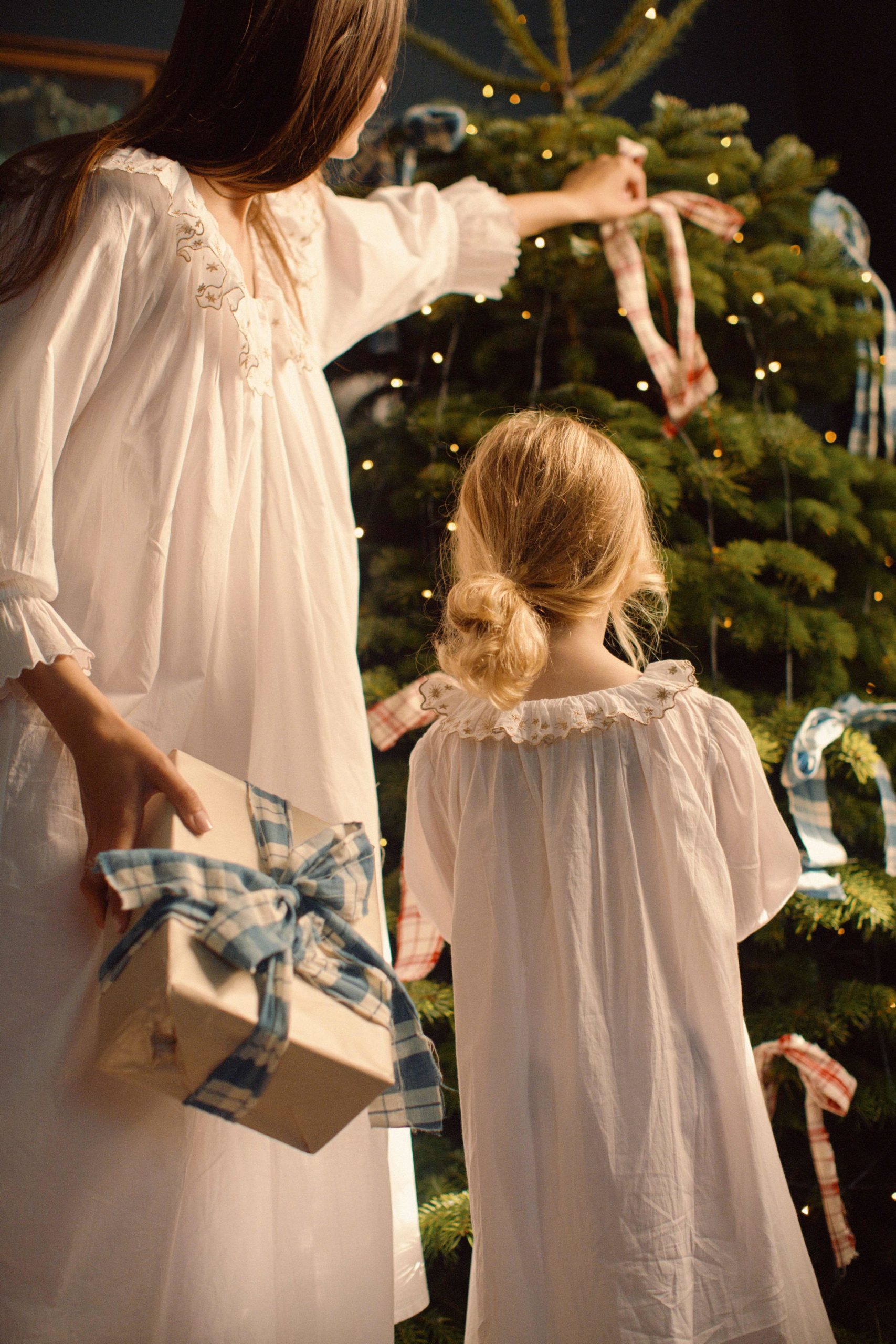 woman and giirl in nighties by Xmas tree | If Only If pop-up