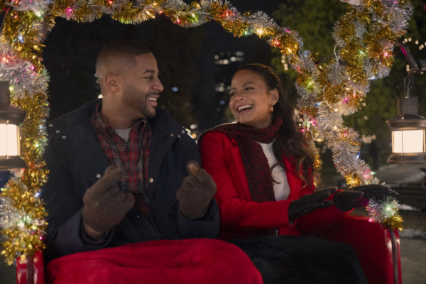 (L to R) Devale Ellis as Teddy and Christina Milian as Layla in Meet Me Next Christmas