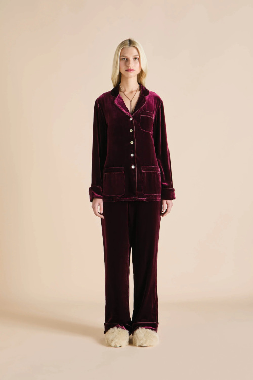 Woman in red velvet PJ set