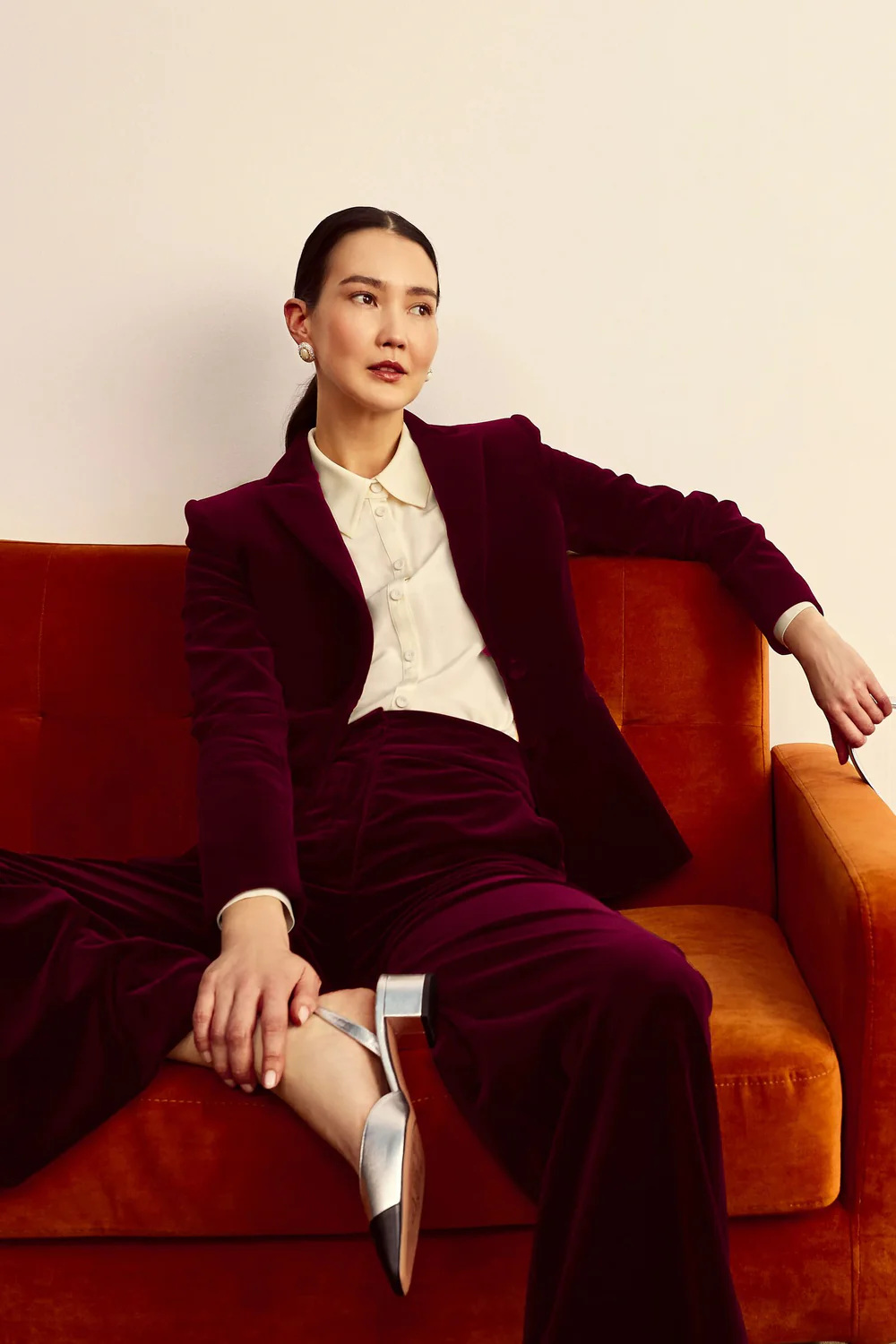 Woman in red velvet suit