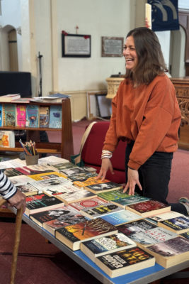 Bookbanks Volunteer Kate Maxwell with a table of books