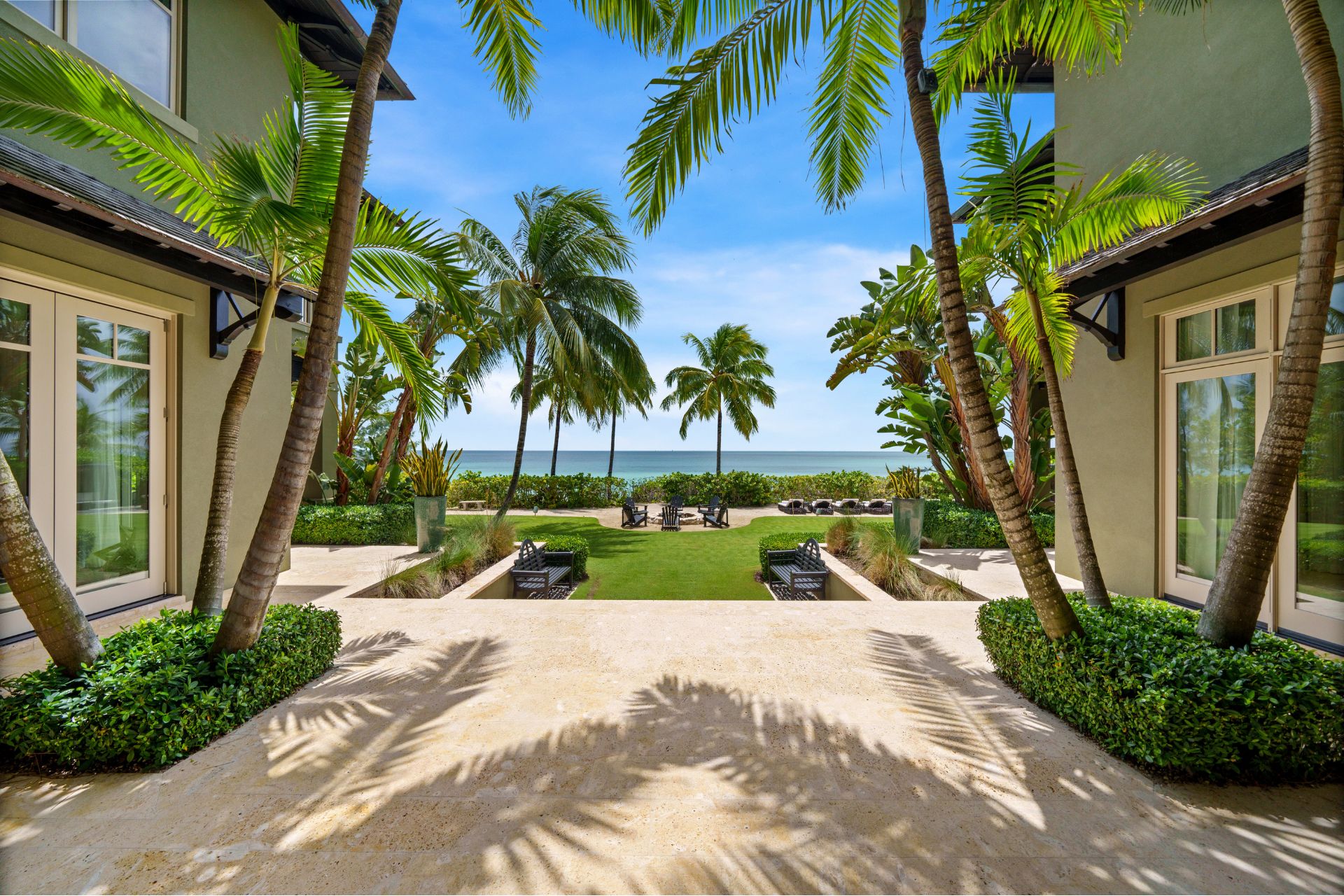 Bahamas manion garden with stone terraces and palm trees
