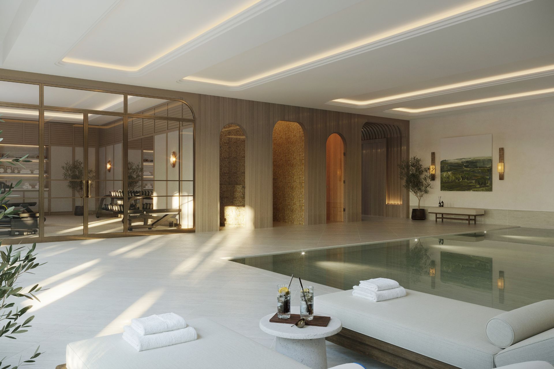 Indoor pool with wooden panelling and cream sun loungers