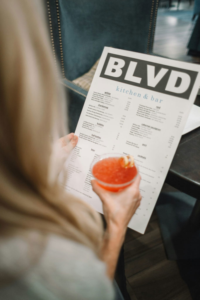 Woman reading a restaurant menu