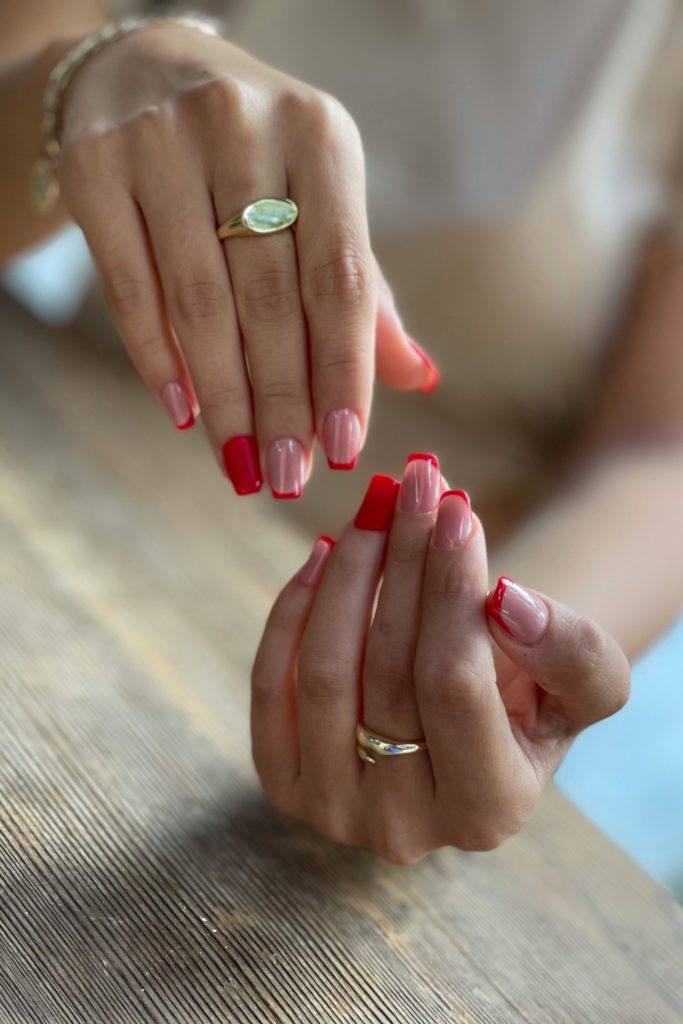 Hands with burgundy French manicure