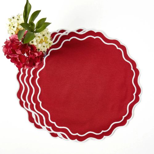 Scalloped red placemats with white border