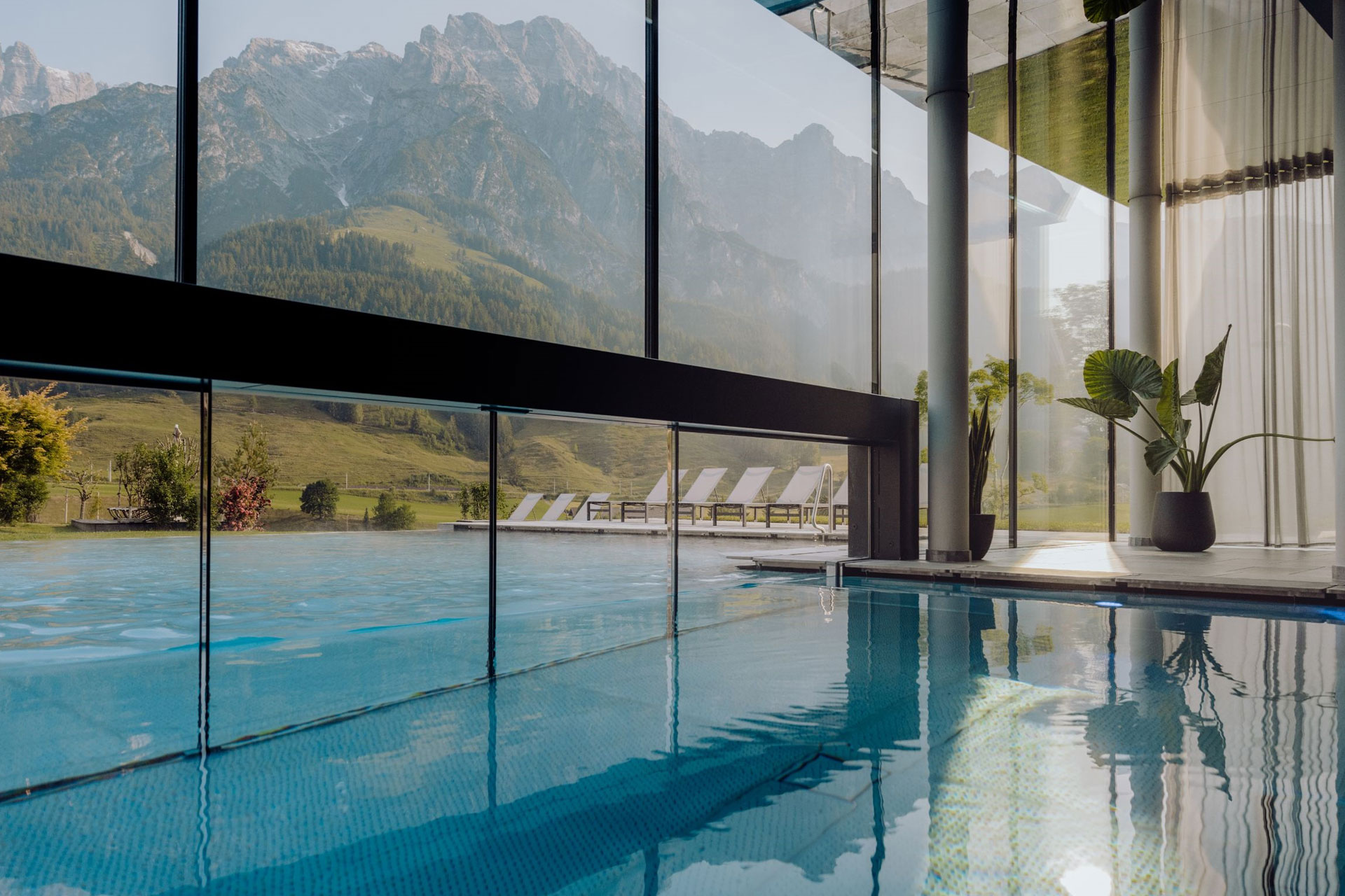 Outdoor/indoor spa with mountain views