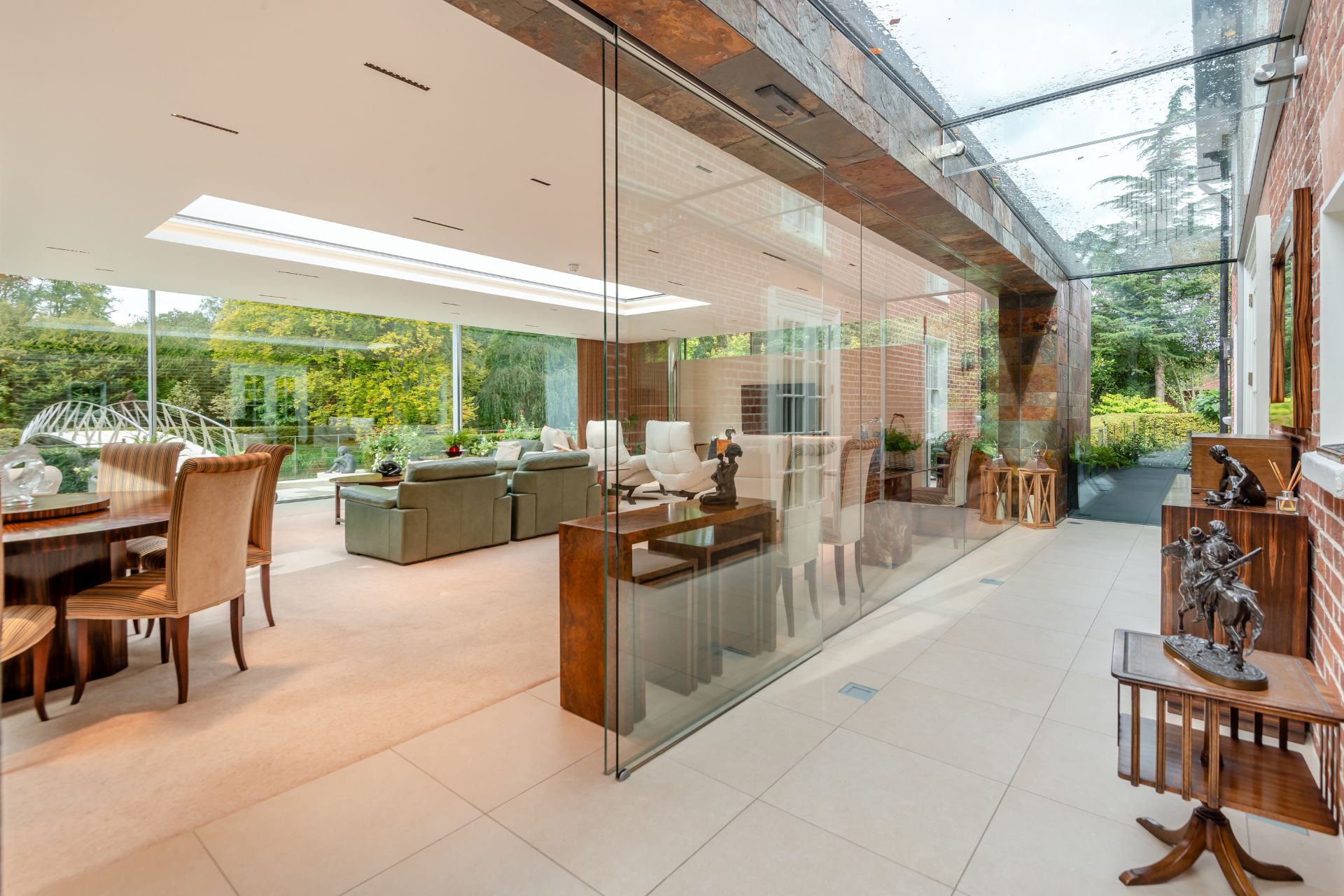 Orangery with floor-to-ceiling windows and a large living space.