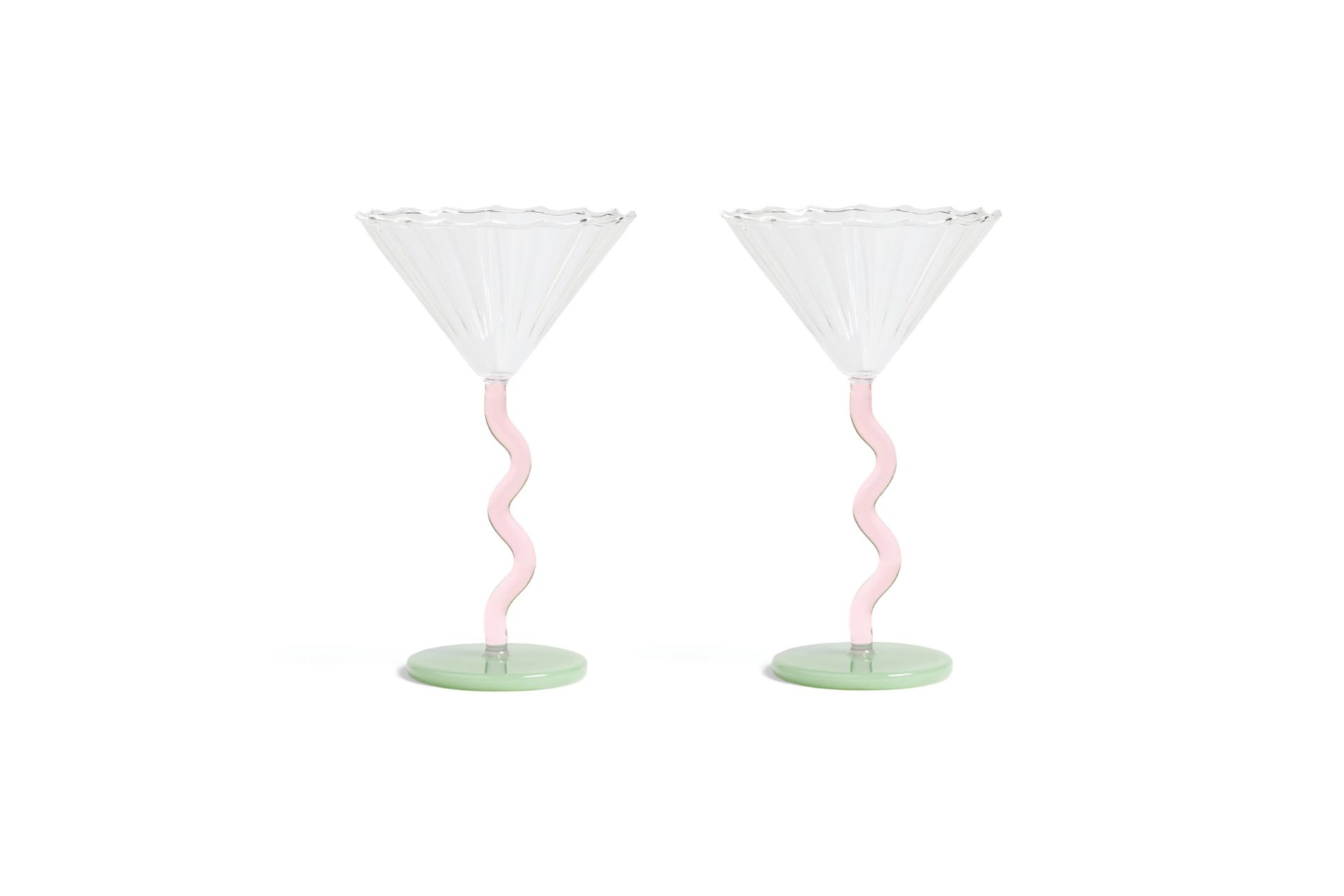 Martini glasses with wavy pink stems and pale green bases.