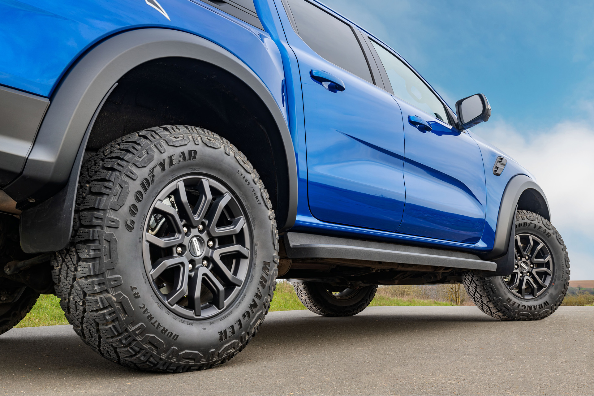 A blue truck with Goodyear tyres
