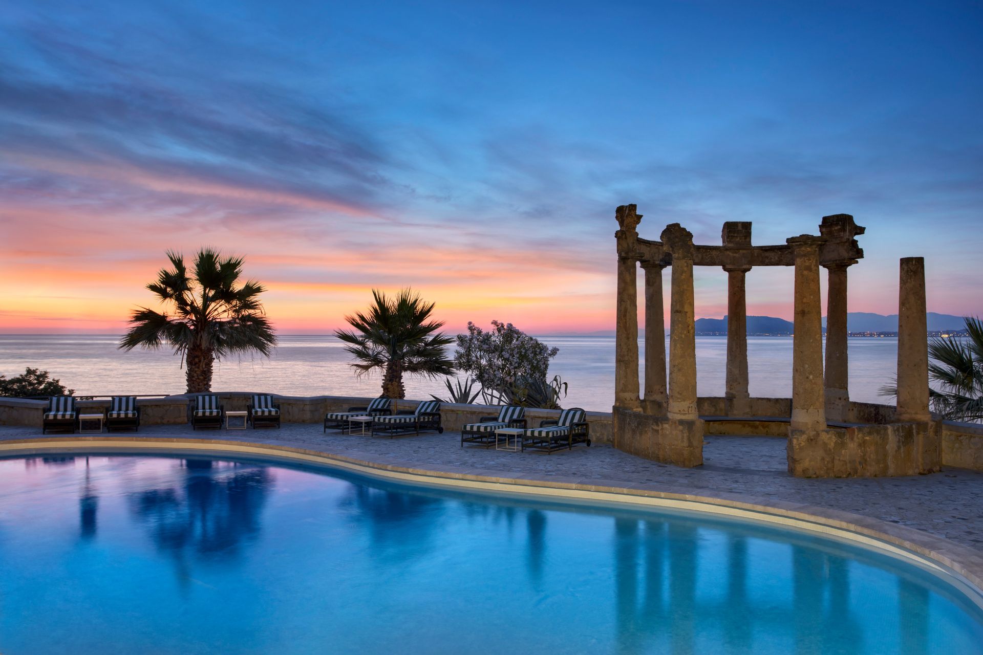 Outdoor pool at sunset